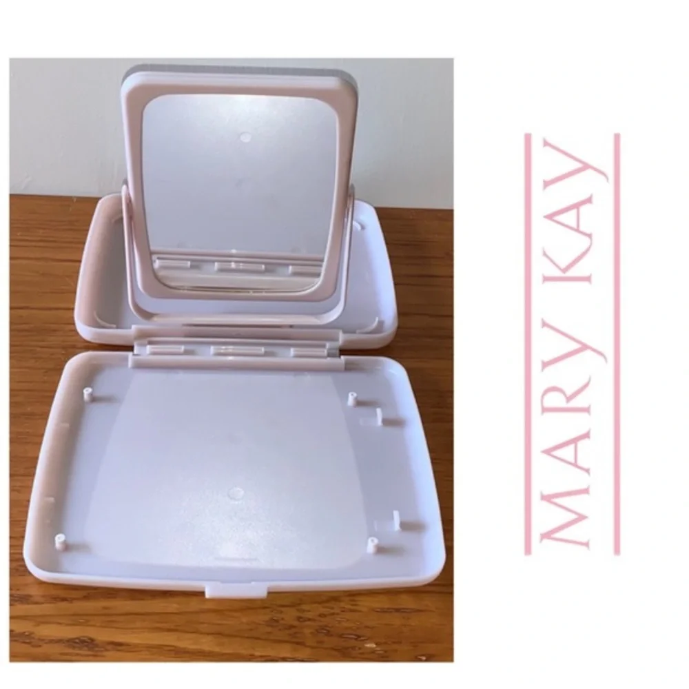Mary Kay pink plastic compact travel mirror.